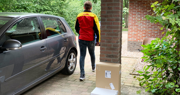 DHL deliverer drops the parcel on an agreed location around the house.